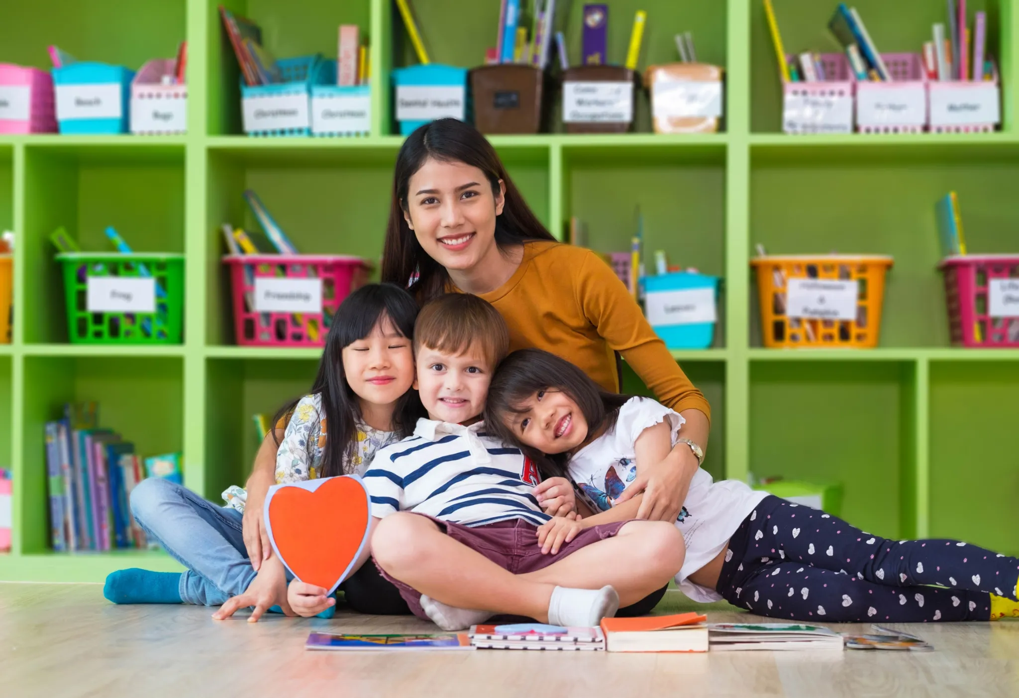 Teacher supporting a young learner